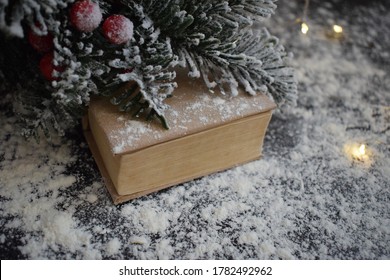 
Book A Gift For Christmas Under The New Year Tree Sprinkled Snow