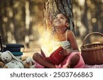 Book, glow and kid with overlay in forest for knowledge, adventure and magic in imagination. Girl, child and picnic with story in nature for fantasy enchantment, literature and exploring creativity