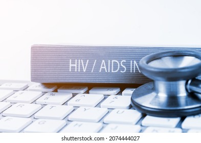 The Book With HIV Text And Stethoscope Medical On Keyboard Computer, Education Medical Concept.