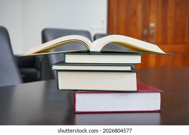 Book Ideas, Hardcover Law Books Stacked And Open Book On Meeting Table In Blur Office Room For Design Business Or Education Background, Pile Of Books