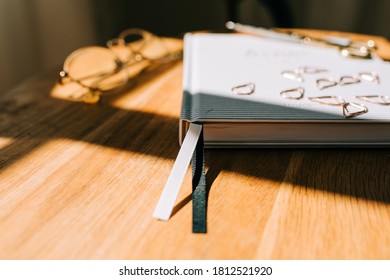 Book Mark Ribbon Of A Journal On A Table At Home