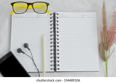 The book and the objects placed on the background. /It is a concept. /With copy space