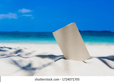 Book On The Beautiful Ocean Beach On The Outdoor Blurred Sea Background