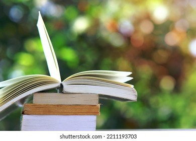 Book On Wood Table And Education Learning In Library Stack Piles Of Book On Table And Idea Concept