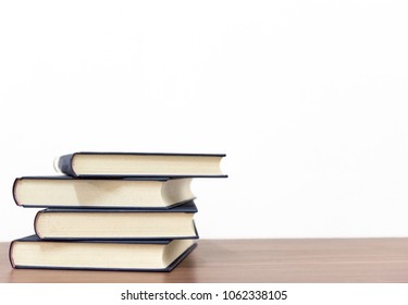 book on wooden table on bright background - Shutterstock ID 1062338105
