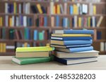 book, pile of old books on wooden shelves,stack of books on wooden table in library, stack of books in the store, blurred background, school, education, library, bookshop,