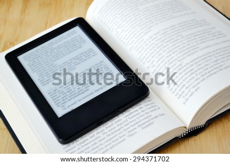 Book reader and an old fashioned book