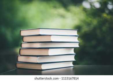 Book Resistance Multiple Books Stacked Neatly On The Table