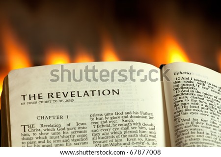 The Book of Revelation with fire burning in the background