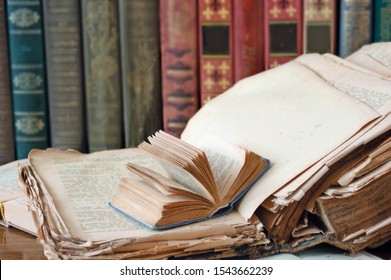 book shelf, books pile with antique books closeup