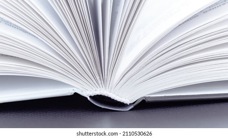 Book spine macro photography. Open book with white pages close-up with copy space. The concept of visiting libraries and reading various books, encyclopedias. Sustainable education concept. - Powered by Shutterstock