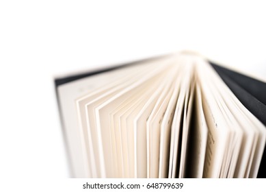 Book Spine And Pages Against An All White Seamless Studio Background