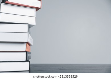 Book stack in the library room and blurred stack book for business and education background, back to school concept. Copy space for text. Distance education, e-learning concept.