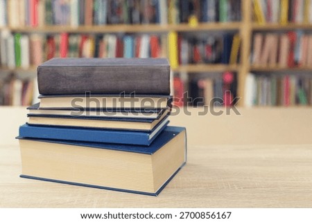 Book stack on the desk in public library, 