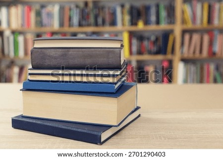 Book stack on the desk in public library, 