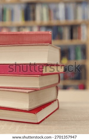 Book stack on the desk in public library, 