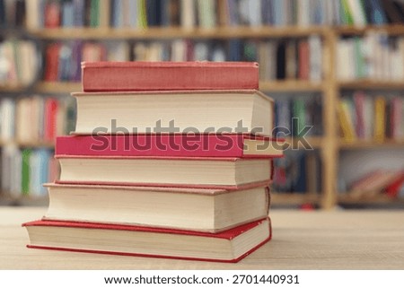 Book stack on the desk in public library, 