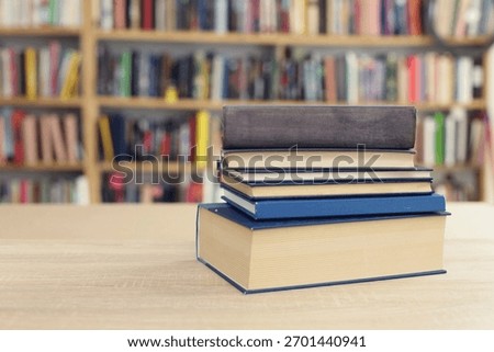 Book stack on the desk in public library, 