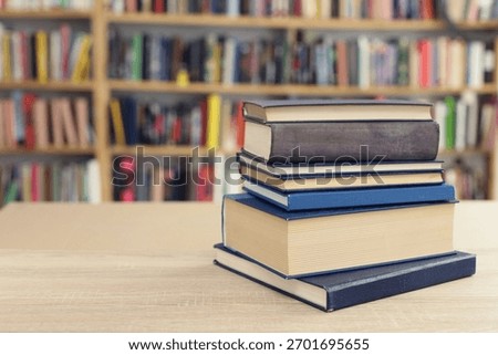 Book stack on the desk in public library, 