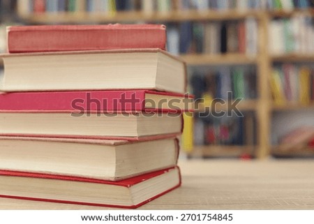 Book stack on the desk in public library, 