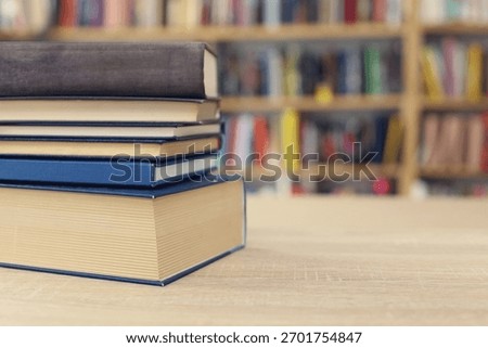 Book stack on the desk in public library, 