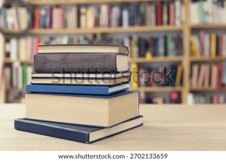 Book stack on the desk in public library, 