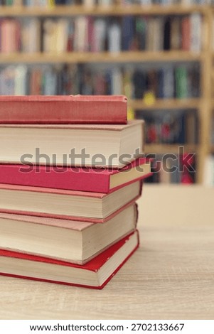 Book stack on the desk in public library, 