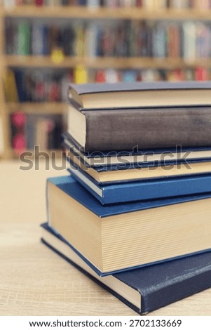 Book stack on the desk in public library, 
