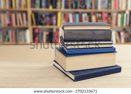 Book stack on the desk in public library, 