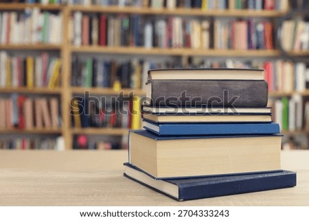 Book stack on the desk in public library, 