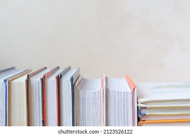 Book Stack In The Room And Blurred Bookshelf For Business And Education Background, Back To School Concept