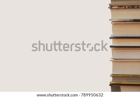 Book stack and white wall background, business and education back to school concept,