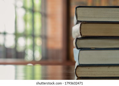 book stack,textbook on desk in library room. education learning concept.