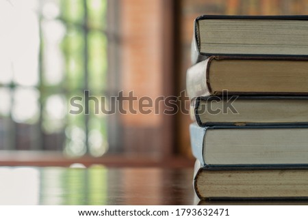 book stack,textbook on desk in library room. education learning concept.