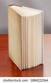 Book Standing Upright On The Table, Whose Pages Appear To Be. With Clipping Path