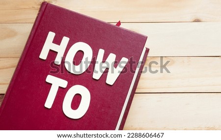 book with text How to , manual guidebook concept