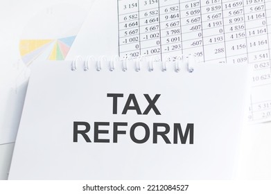 Book With Text TAX REFORM On The Table Next To The Documents