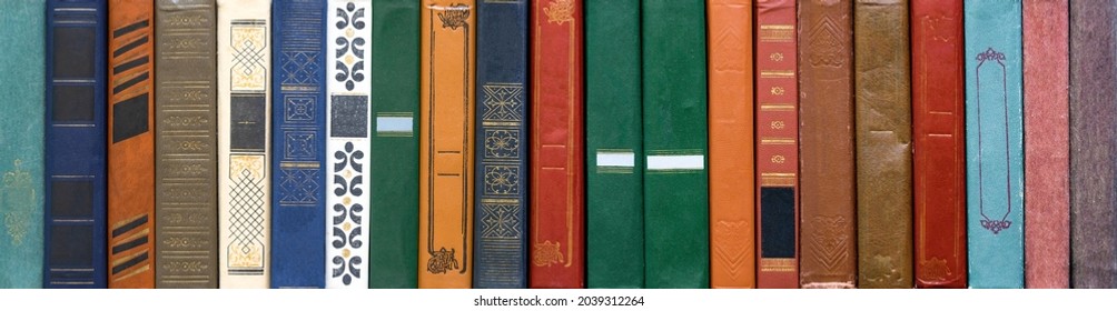 Book texture. Different vintage books in row. Literature, reading concept.