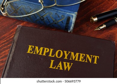 Book With Title Employment Law On A Table.