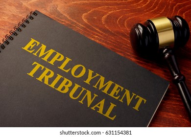 Book with title employment tribunal on a table. - Shutterstock ID 631154381
