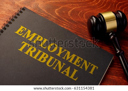 Book with title employment tribunal on a table.