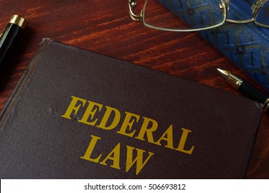 Book With Title Federal Law On A Table.