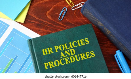 Book With Title HR Policies And Procedures On A Table.