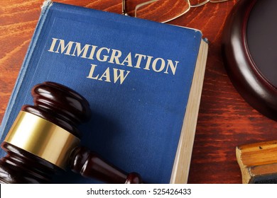 Book with title immigration law on a table. - Shutterstock ID 525426433