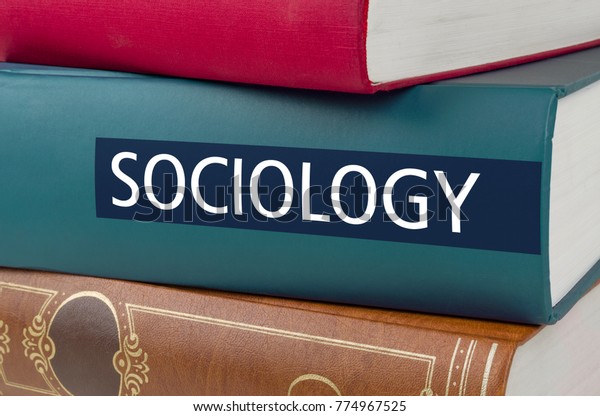 A book\
with the title Sociology written on the\
spine