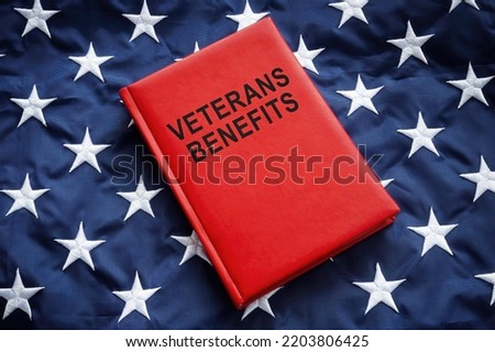 Book veterans benefits on a big flag.