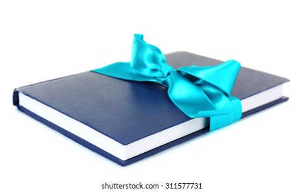 Book Wrapped With Color Ribbon Isolated On White