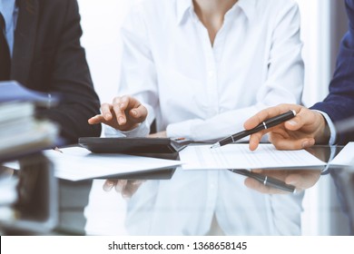 Bookkeepers team or financial inspectors  making report, calculating or checking balance. Tax service financial document. Audit concept - Shutterstock ID 1368658145
