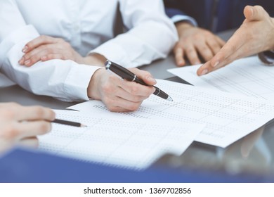 Bookkeepers team or financial inspectors  making report, calculating or checking balance. Group of people at work. Business operations concept - Shutterstock ID 1369702856