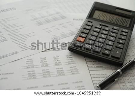 bookkeeping accounting concept. calculator on financial statement and balance sheet annual.